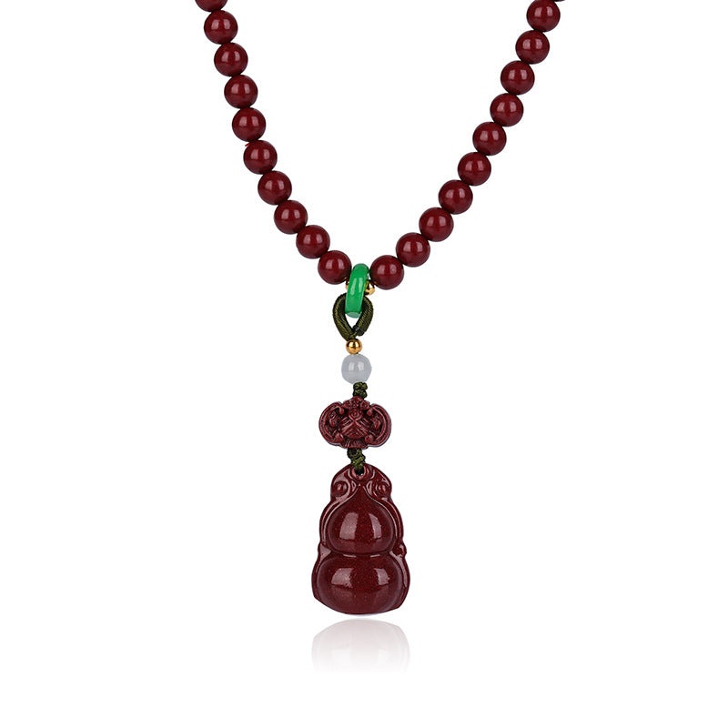 The 108 - bead cinnabar jewelry displayed as a necklace against a white background Clearly presenting the pendant and uniformly colored red beads.