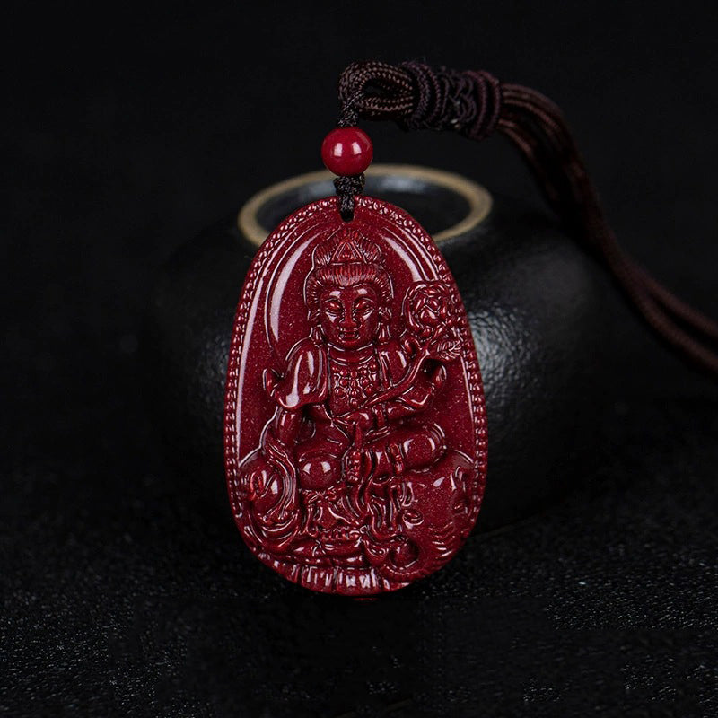 A cinnabar pendant showing a Bodhisattva with a flower, hanging beside a black pot. The detailed carving showcases the artistry.